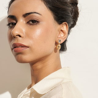 Nyssa drop earrings 18K gold-plated metal with a faceted blue topaz stone & gold pebble drop