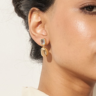 Nyssa drop earrings 18K gold-plated metal with a faceted blue topaz stone & gold pebble drop