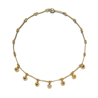 Oyster delicate gold necklace with small multicolour bezel-set gemstone drops along a fine chain